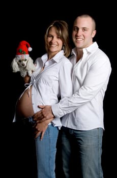happy christmas pair with their dog on black