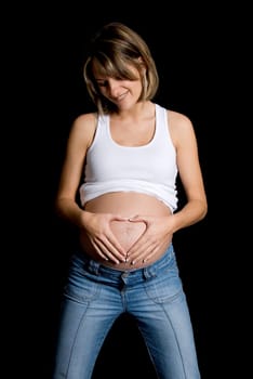 hands doing a heart shapeon the belly