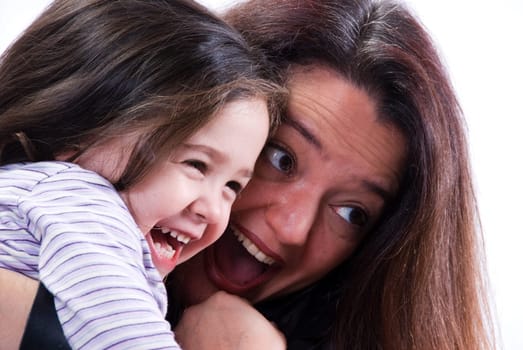 Mom and girl playing on white background