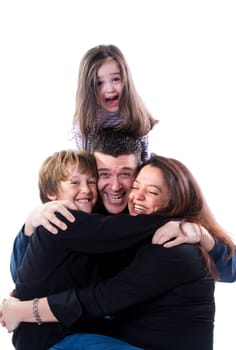 mom and dad with siblings on a white
