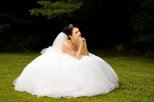 White Bride at her wedding posing with veil