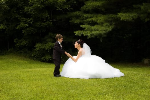 White Bride at her wedding posing with veil
