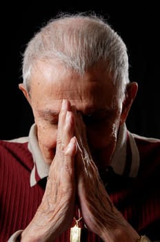 elderly's faith by praying with clasped hands