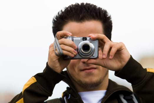 a tourist with his camera taking a picture