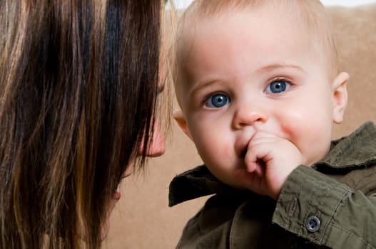 mom happy with their baby boy blue eyes