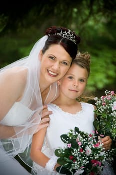 White Bride at her wedding posing with veil