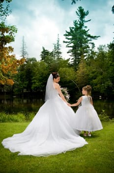 White Bride at her wedding posing with veil