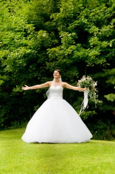 White Bride at her wedding posing with veil