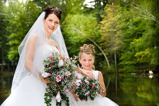 White Bride at her wedding posing with veil