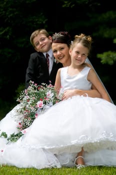 White Bride at her wedding posing with veil