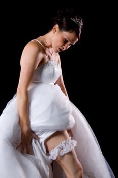 White Bride at her wedding posing with veil