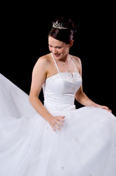 White Bride at her wedding posing with veil