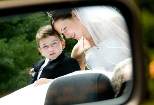 White Bride at her wedding posing with veil