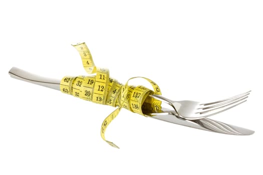 Fork and knife wrapped by measure tape. Isolated on white background