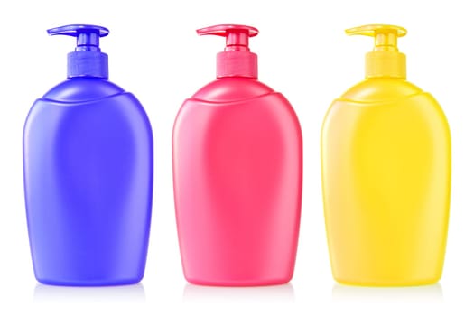 three color plastic bottles with liquid soap