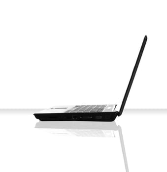 a single laptop on a white table and background