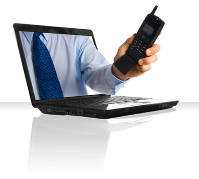 A hand through a laptop giving a phone