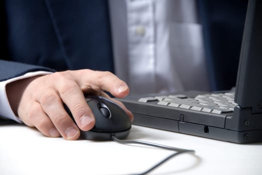 laptop with hand and mouse
