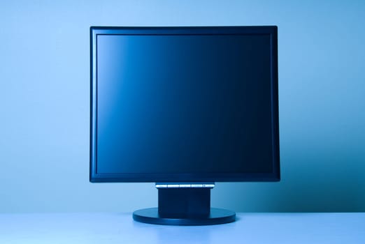 stand alone computer screen on blue