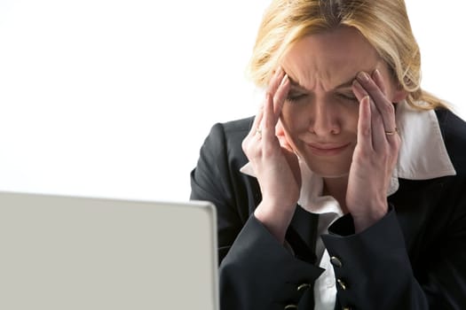 Photo of frustrated businesswoman touching her head in suffer