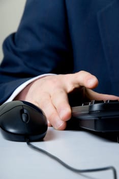 businessman cruching number on keypad