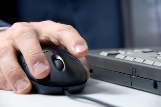 laptop with hand and mouse