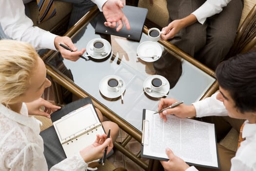 Above view of confident businesspeople planning work in the room