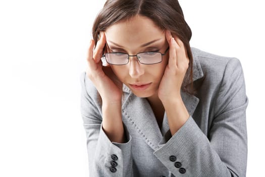 Portrait of a businesswoman in glasses rubbing her temples