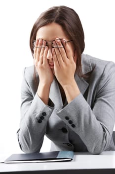 Portrait of a businesswoman in glasses rubbing her eyes
