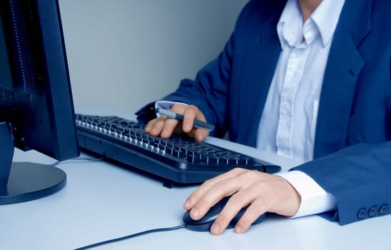 man with pen searching the internet