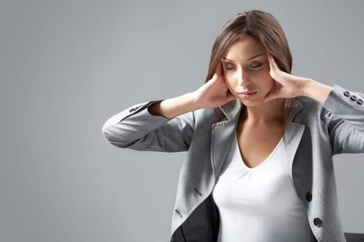 A businesswoman trying to relax her eyes