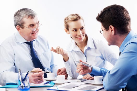 Portrait of three businesspersons brainstorming during coffee break