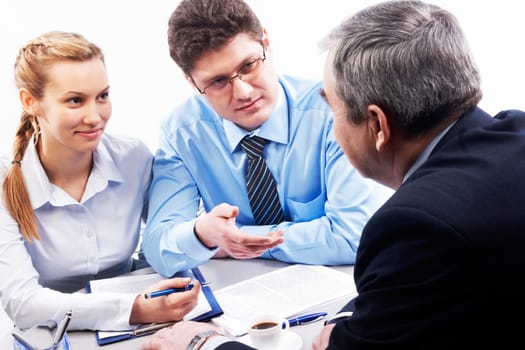 Image of two businesspeople speaking something to their boss