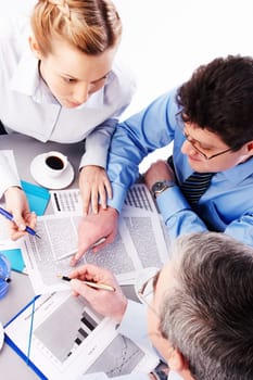 Image of two businessmen advise young colleague