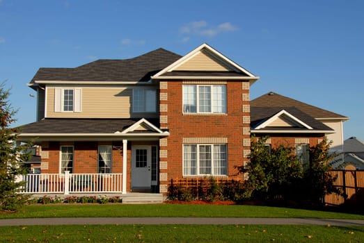 red brick house with blue sky in summer