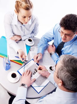 Photo of business persons planning their work