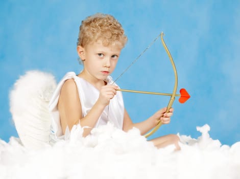 Portrait of little male cupid with bow
