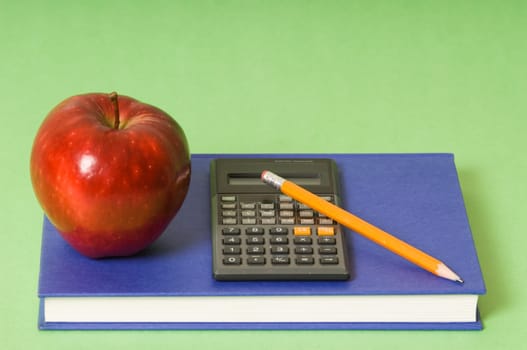math class with red apple and yellow pencil