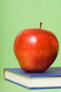 closeup of a red apple on a book