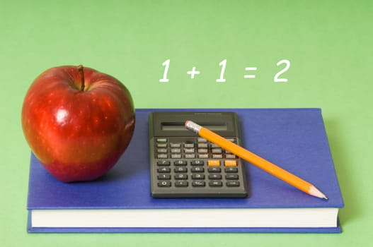 math class with red apple and yellow pencil