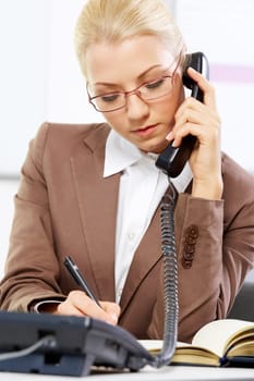 Portrait of a young beautiful businesswoman talking on the phone