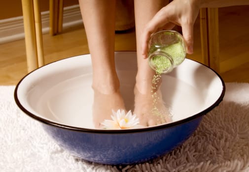 woman in foot bowl at a spa