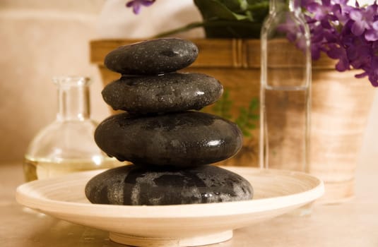 stones, oils, basket and flowers at a spa