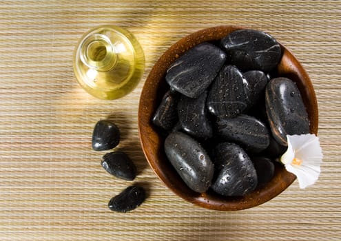 bowl of hot stones for lastone massage