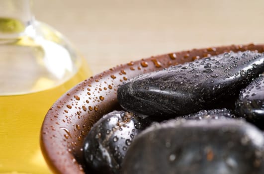 bowl of hot stones for lastone massage