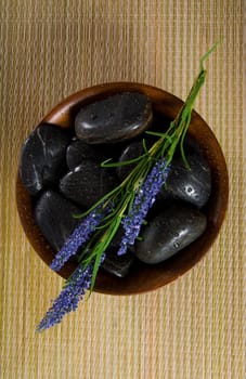 bowl of hot stones for lastone massage