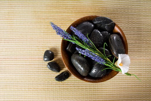bowl of hot stones for lastone massage