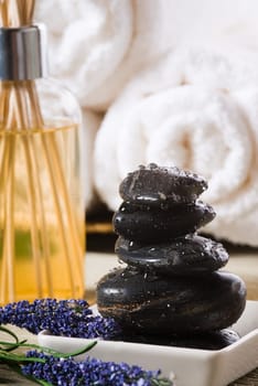 massage stones and towels spa tools and oil