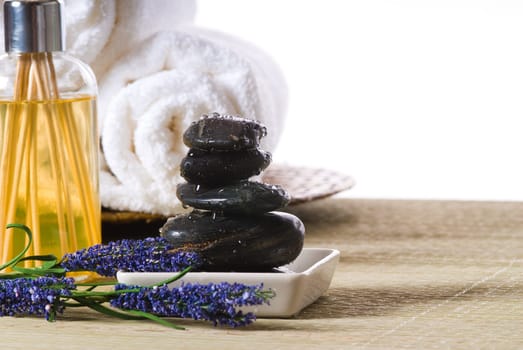 massage stones and towels spa tools and oil