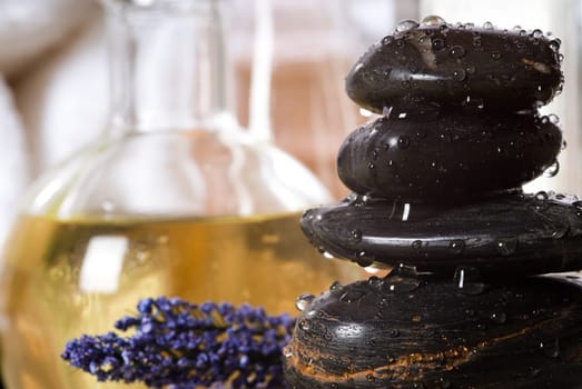 massage stones and towels spa tools and oil